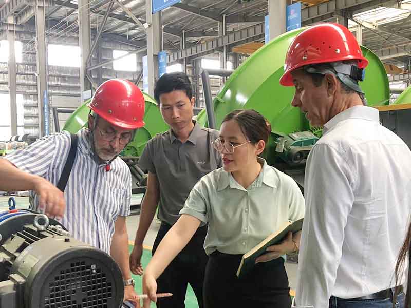 Customers from the United States inspect pellet mill